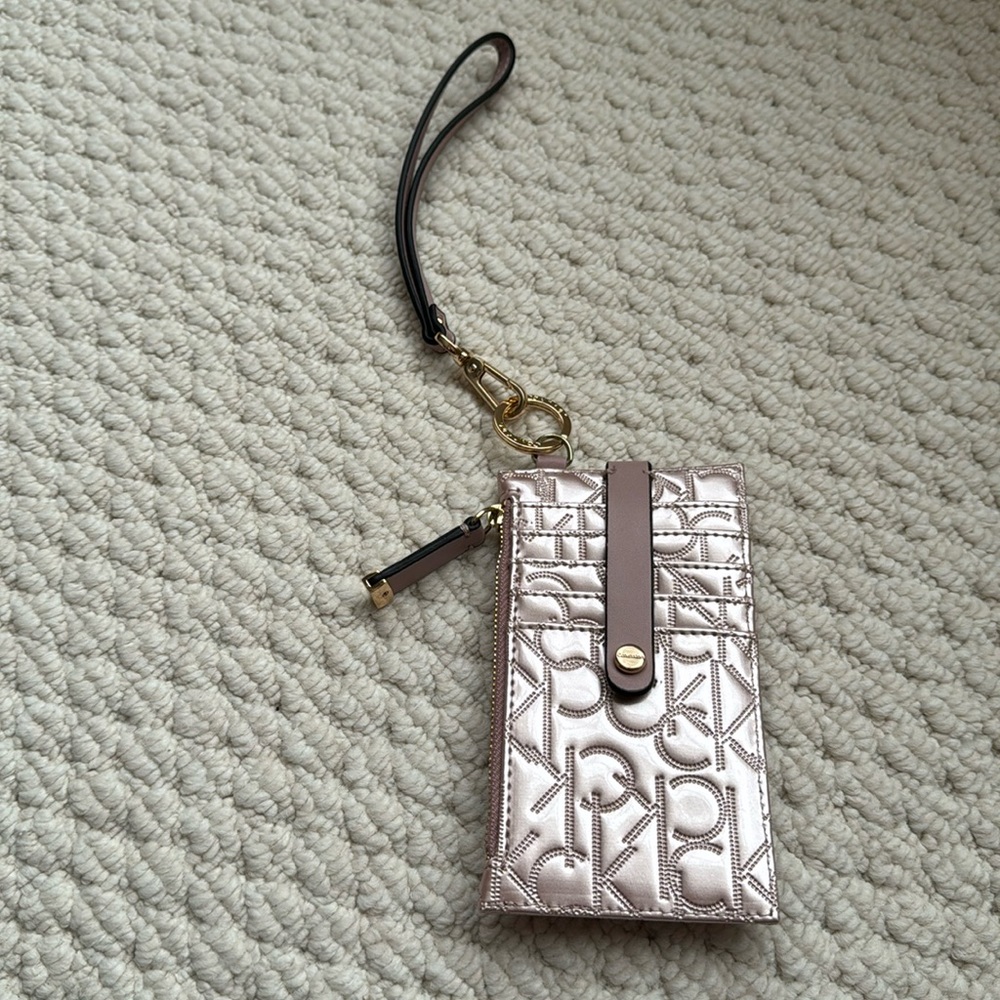 Calvin Klein card holder. Never worn/used.